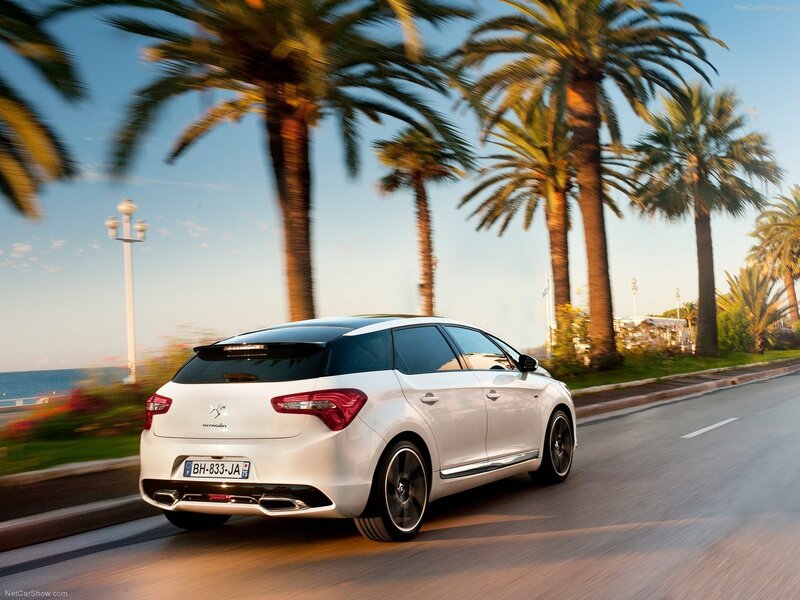 White Citroën DS4 driving on a coastal road
