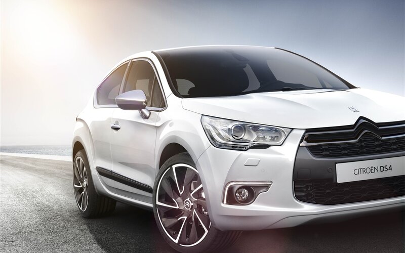 White Citroën DS4 on coastal road