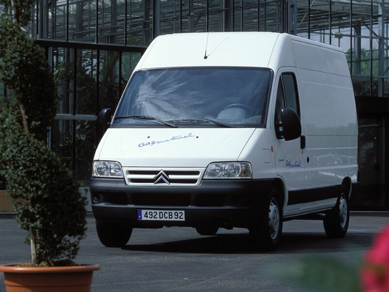 White Citroën van in front of greenhouse
