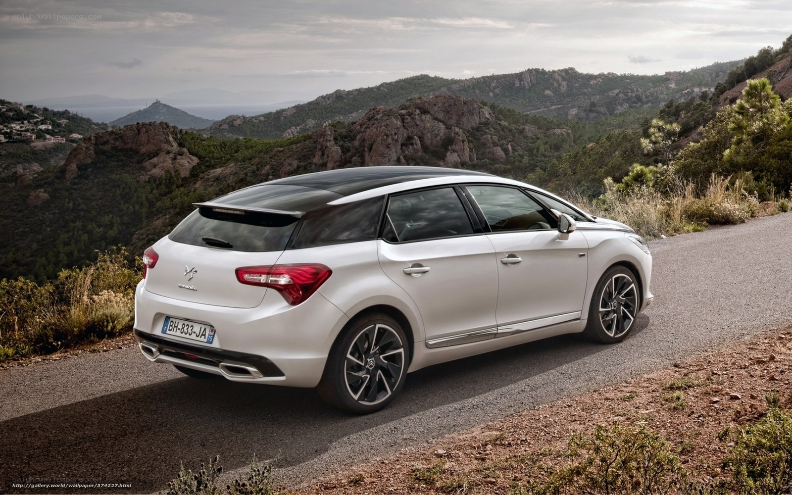 White Citroen DS5 on a mountain road