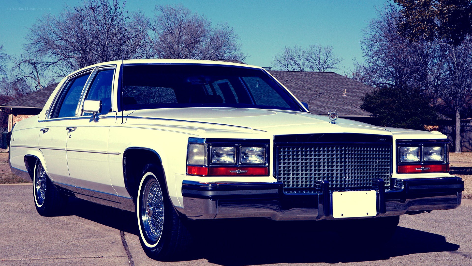 white classic cadillac sedan