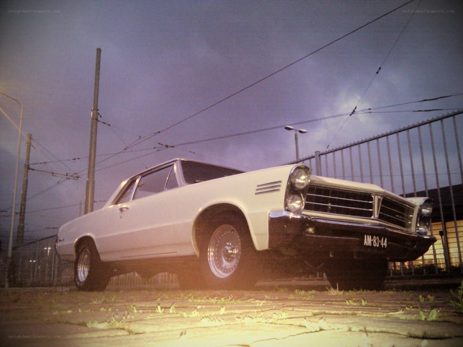White classic car at dusk