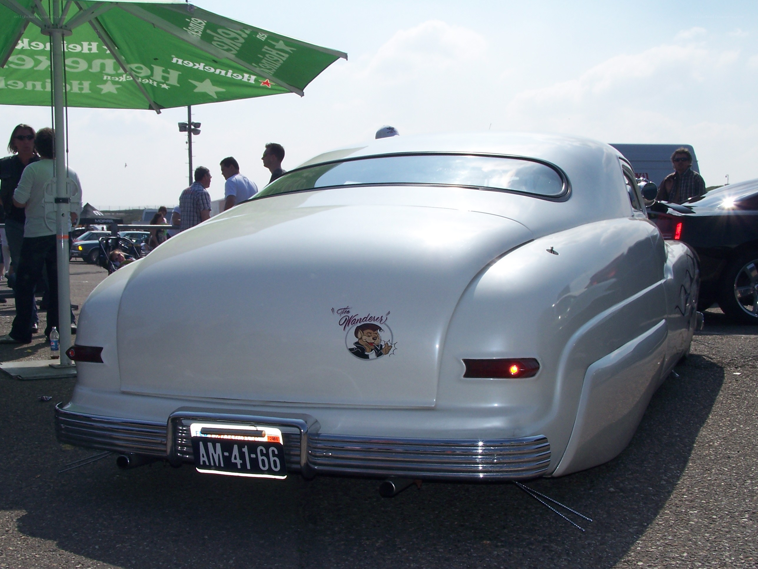 White classic car at outdoor show