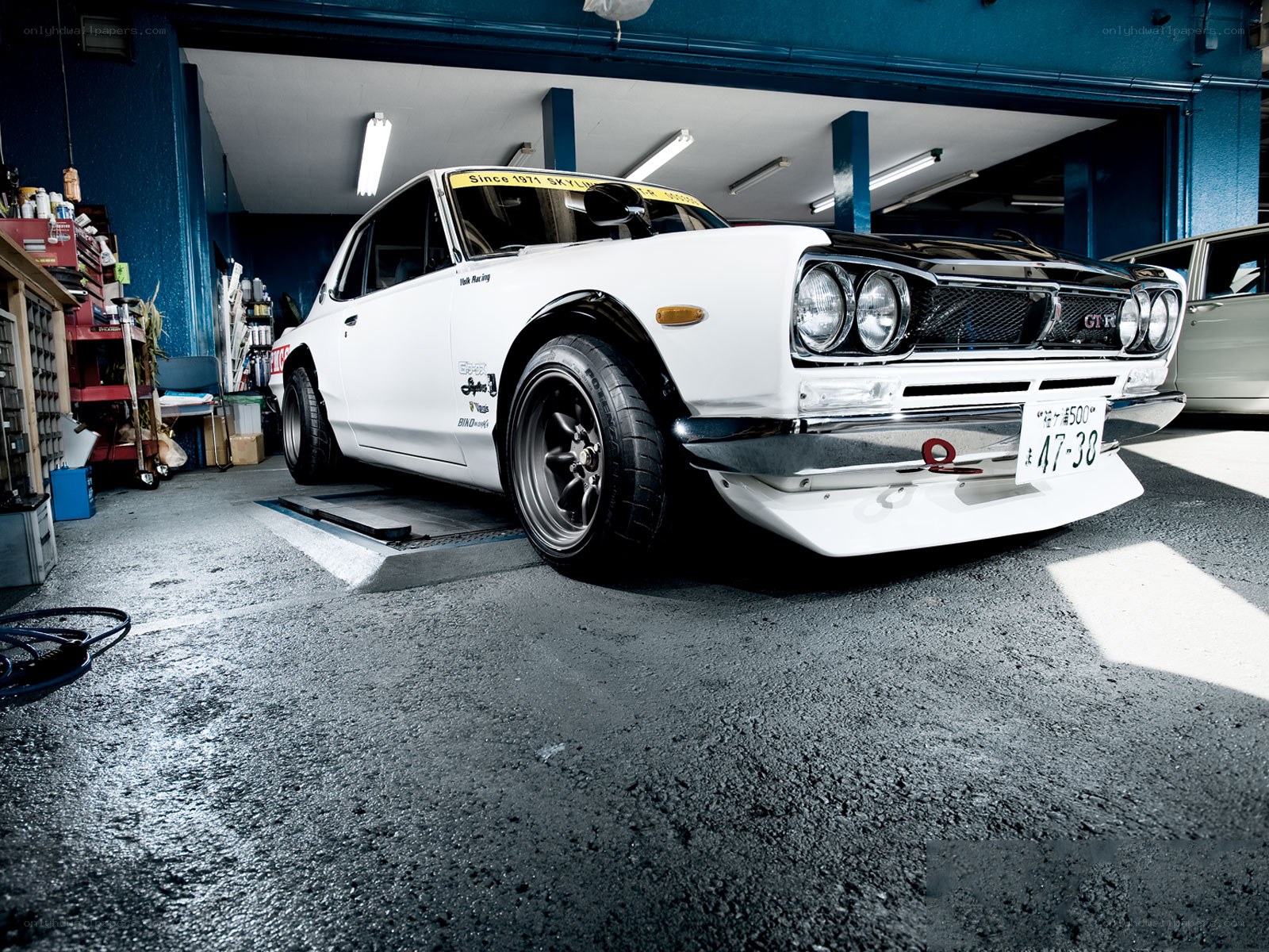 White classic car in garage
