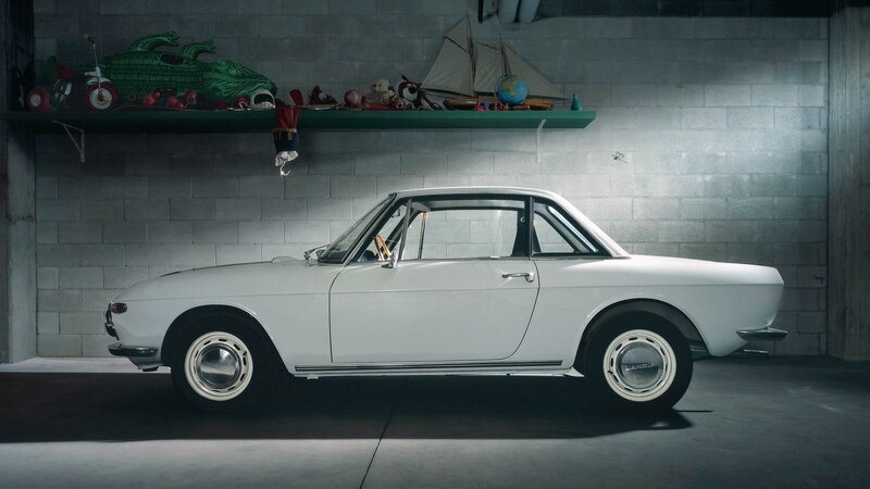 White classic car in garage
