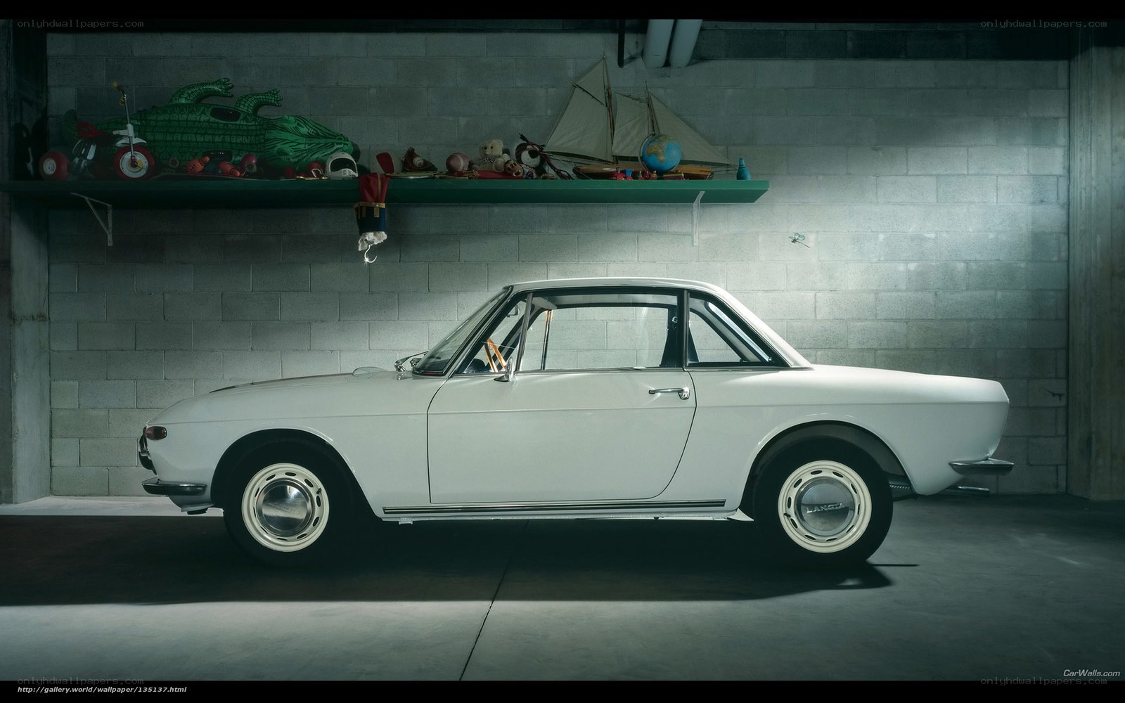 White classic car in garage