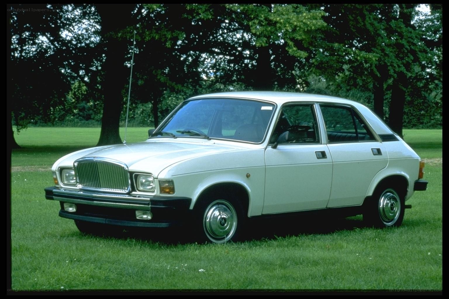white classic car in park