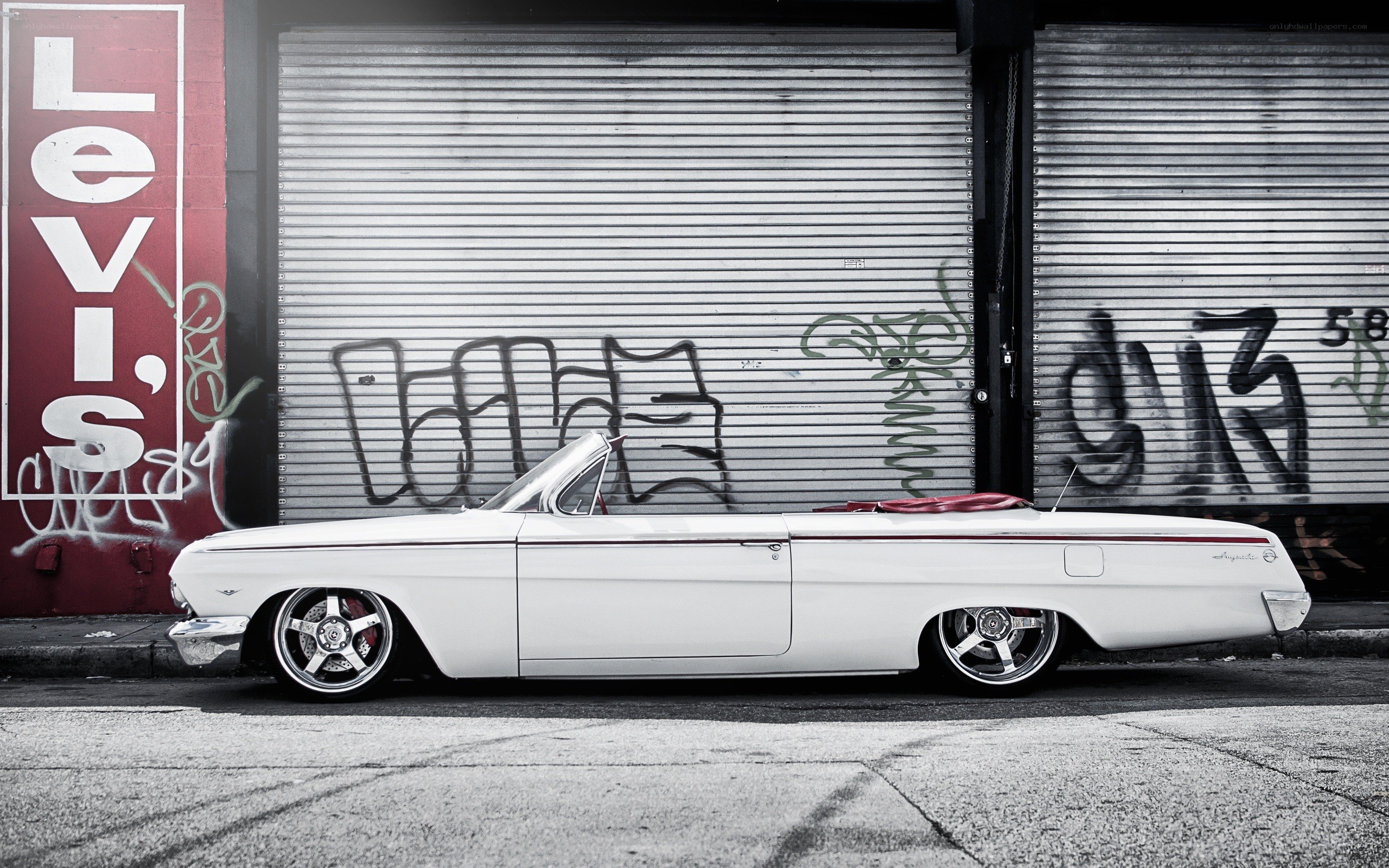 White classic car in urban setting