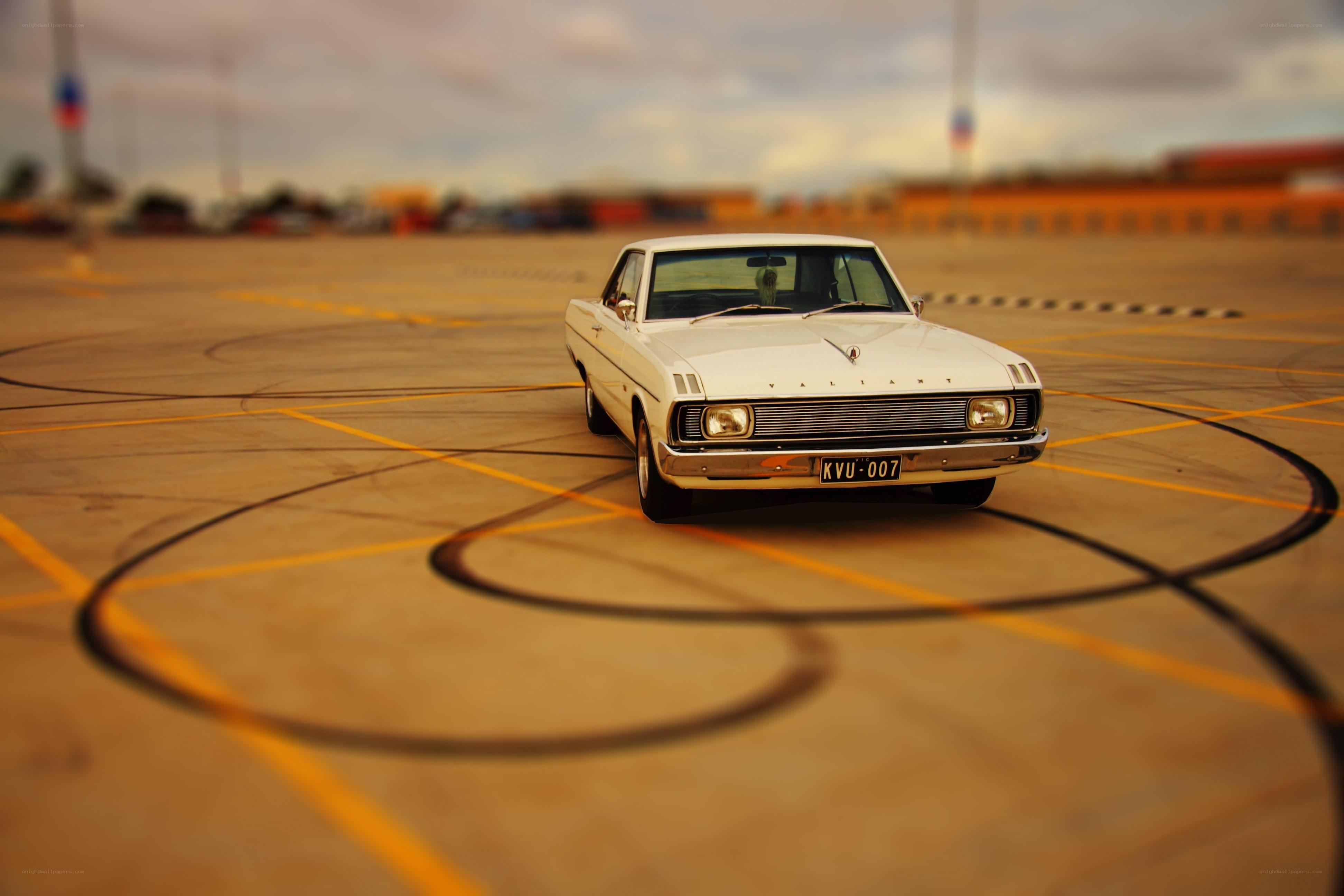 White classic car on a track
