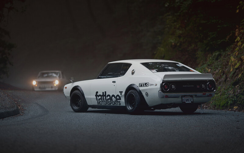 White classic car on a winding road