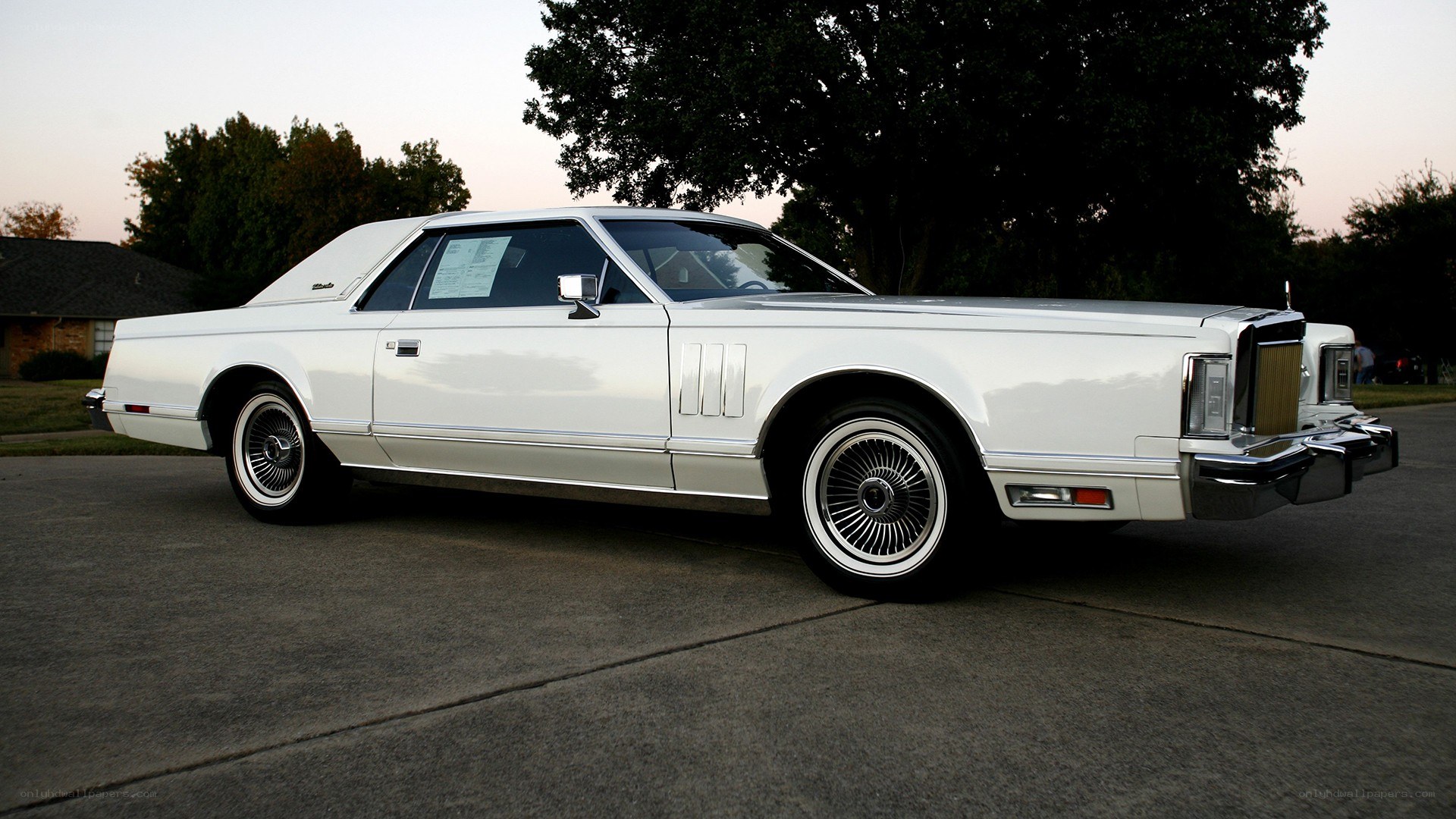 white classic car on driveway