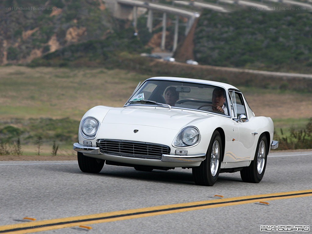white classic car on road