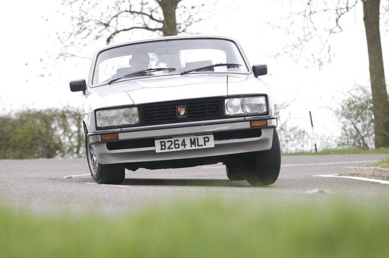 white classic car on road