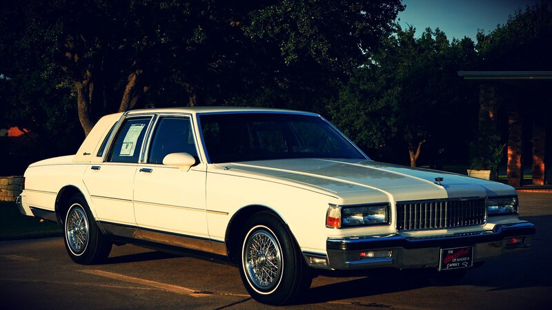 white classic car parked outside