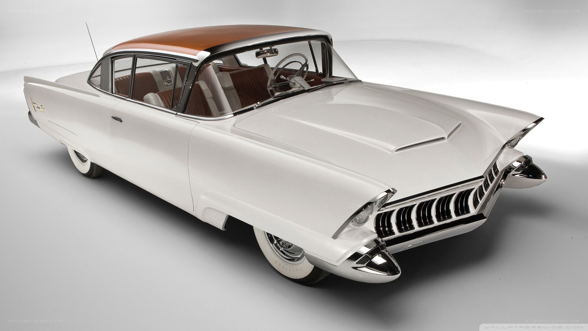 white classic car with brown roof