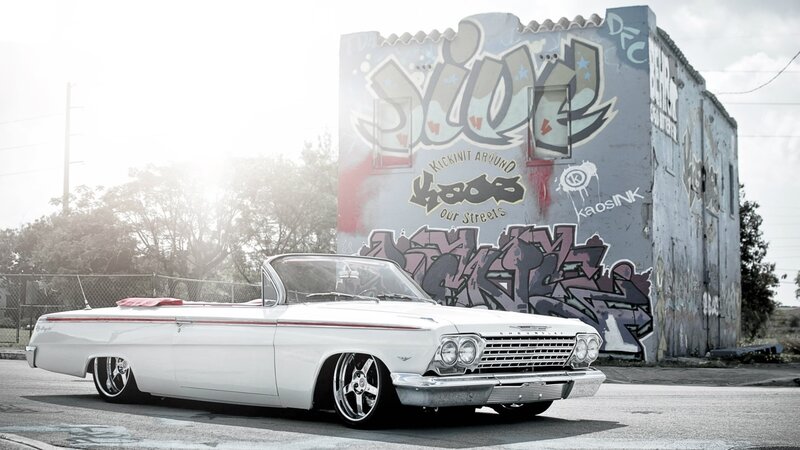 White classic car with graffiti