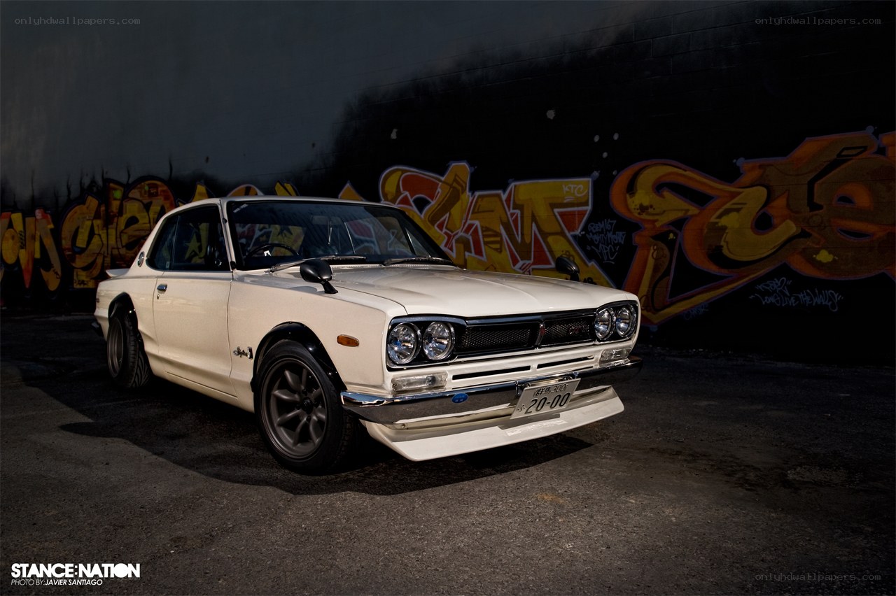 White classic car with graffiti