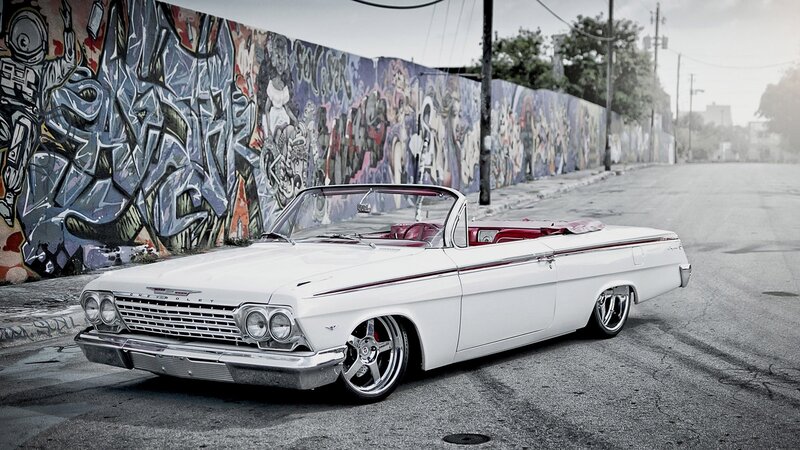 White classic convertible on street