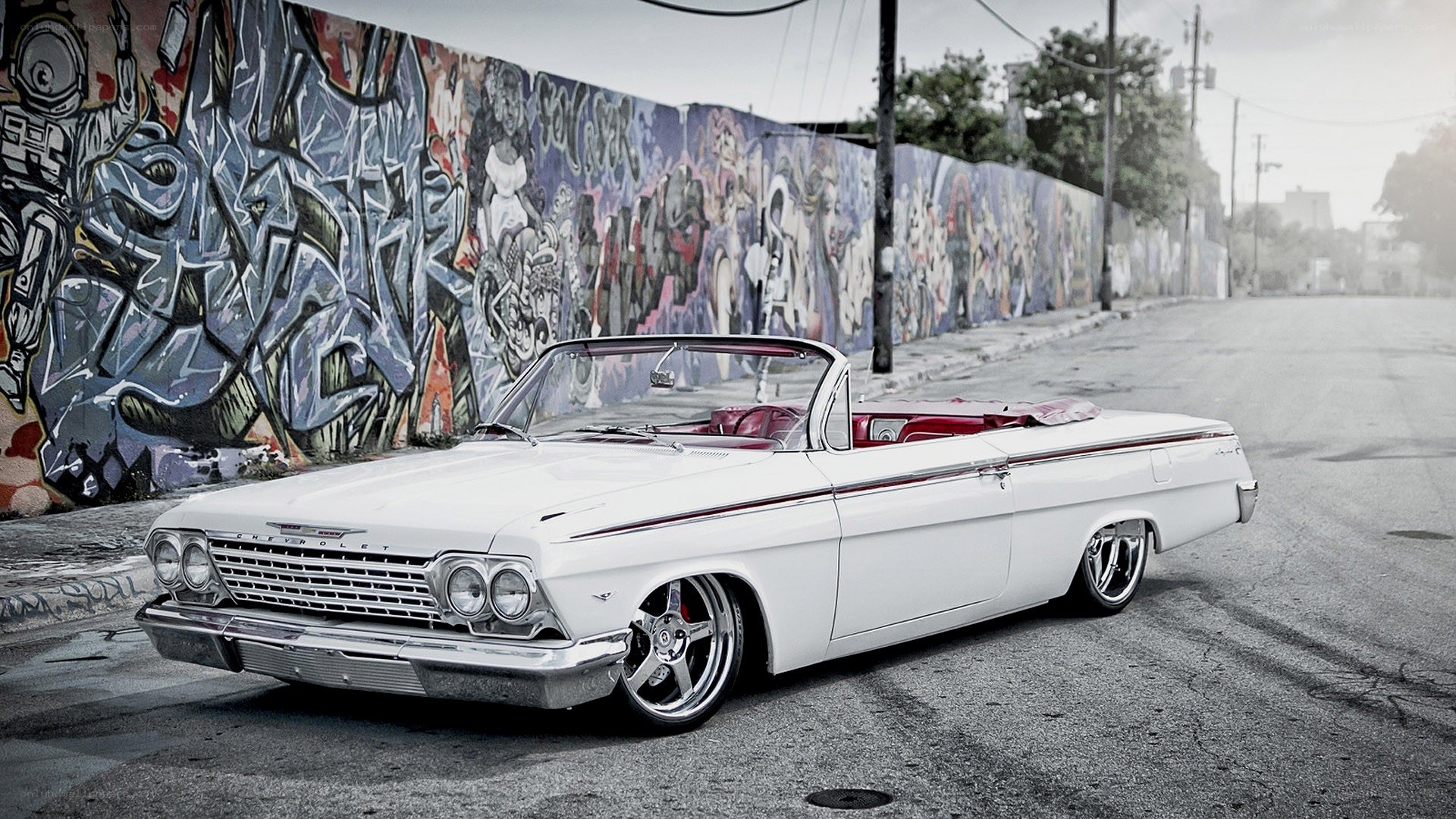 White classic convertible on street
