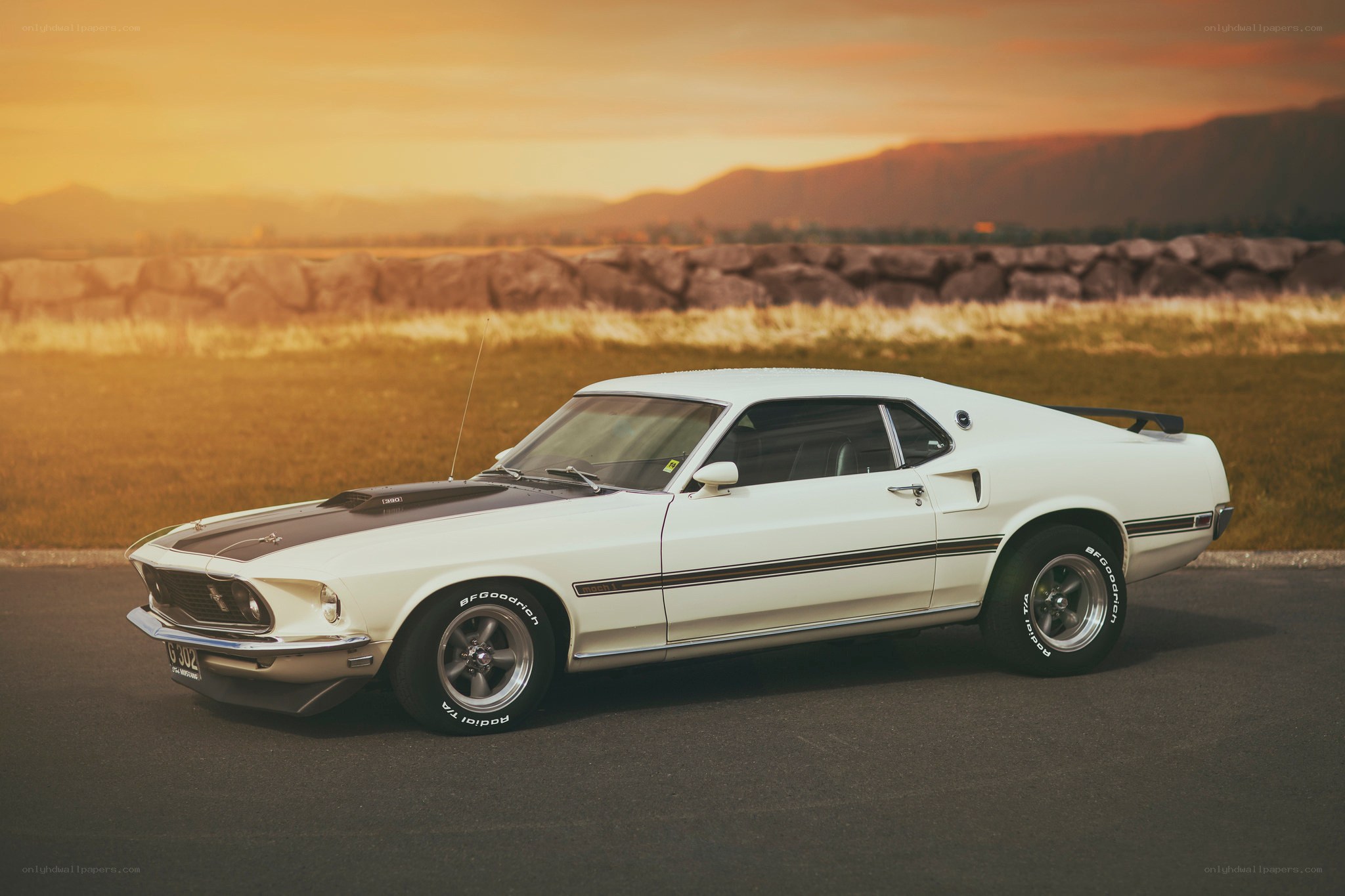 White classic muscle car at sunset