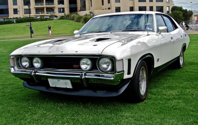 White classic muscle car on grass