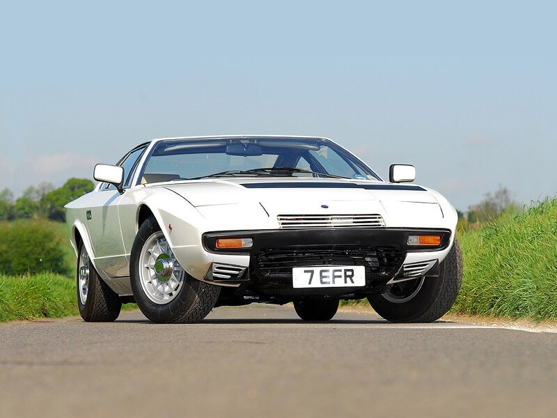 white classic sports car on road