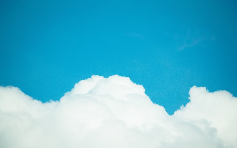 white clouds against blue sky
