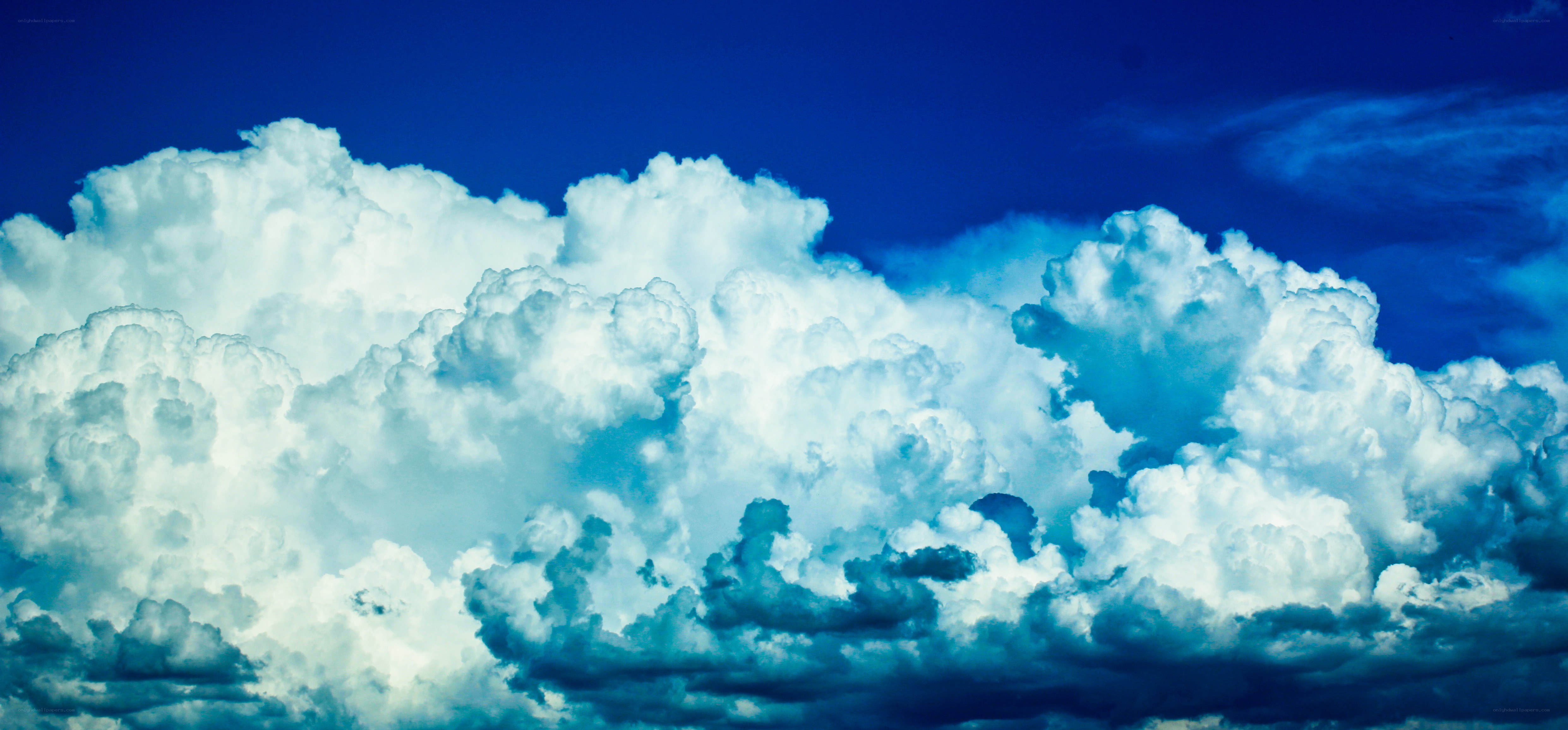 white clouds against blue sky