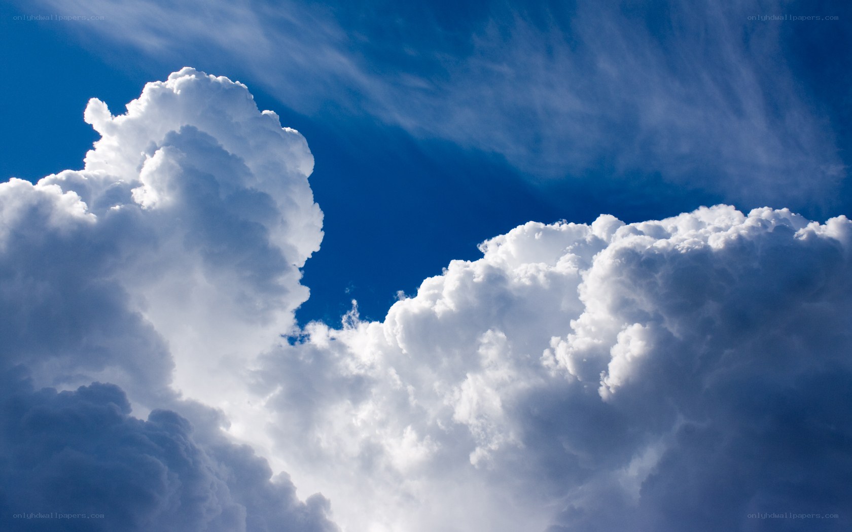 White clouds against blue sky