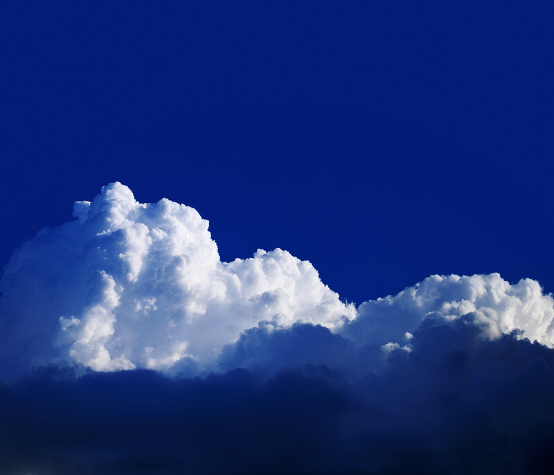 white clouds against blue sky