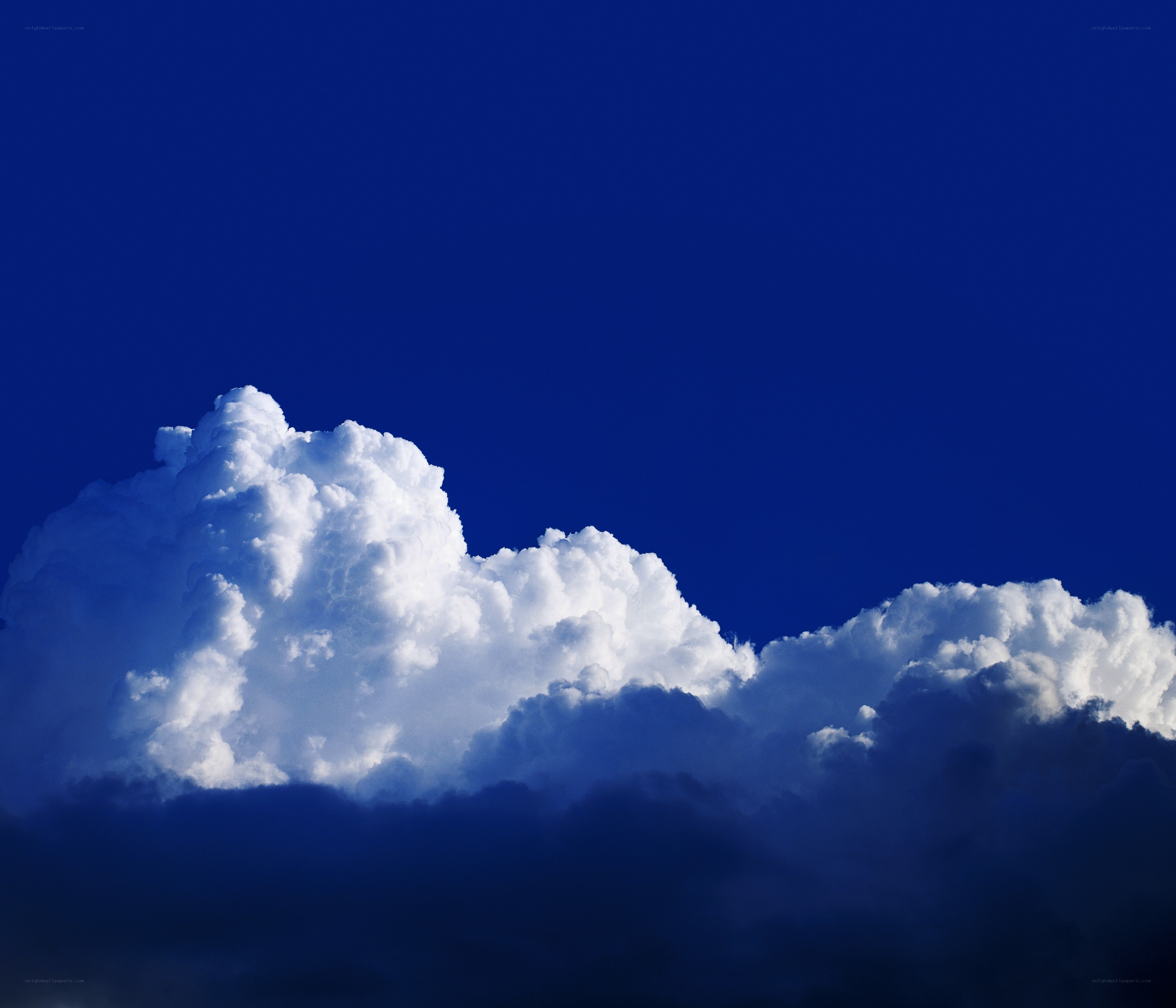 white clouds against blue sky