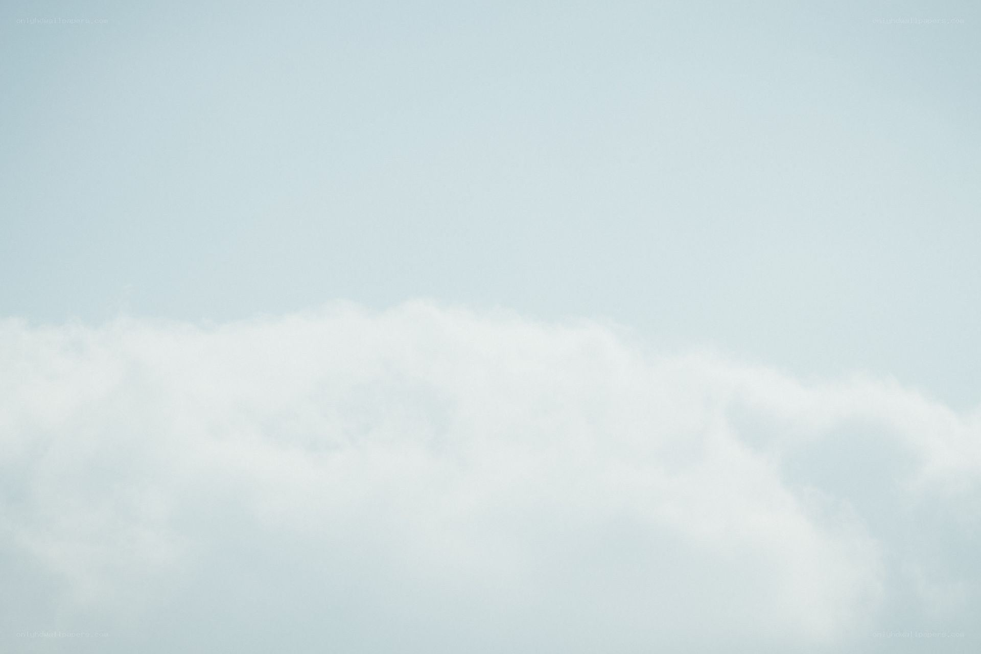 white clouds in a pale sky