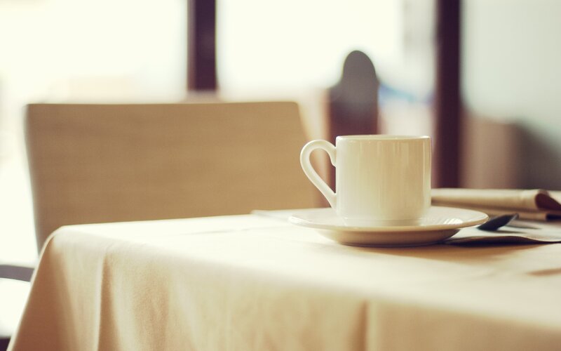 White Coffee Cup on Table — Beige