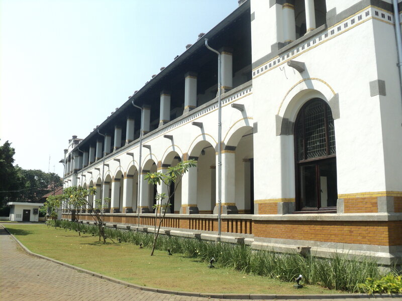 White Colonial Building — Serene