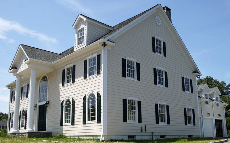 white colonial house with black shutters