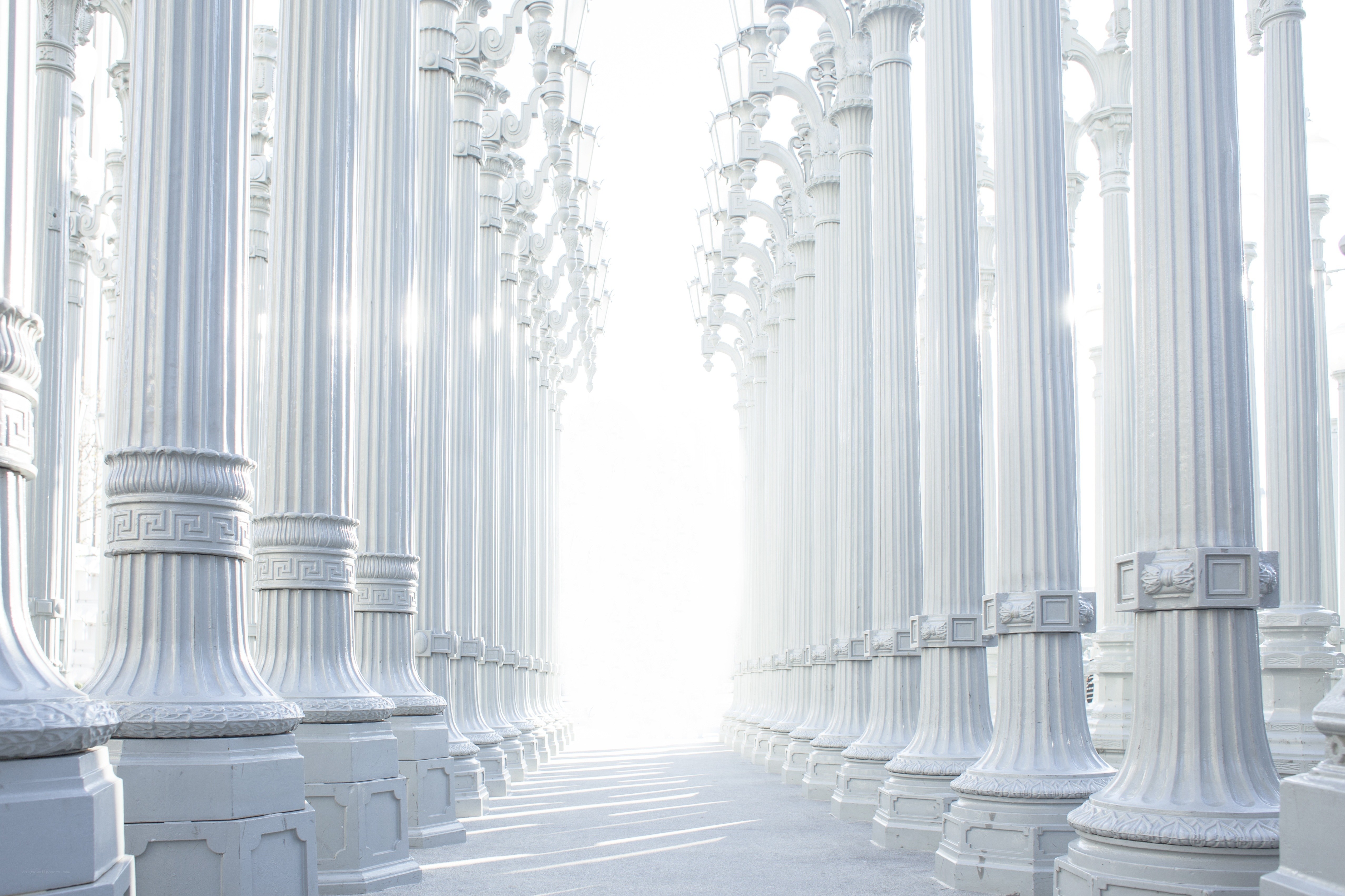 White columns in a bright corridor