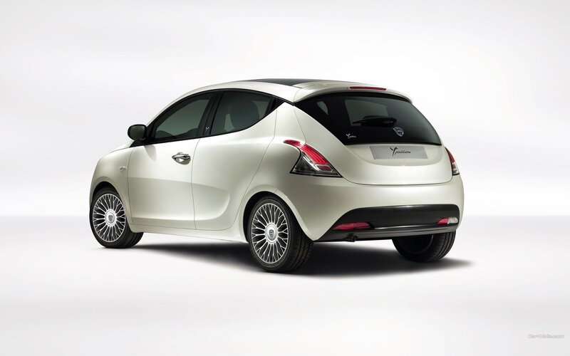 white compact car from rear