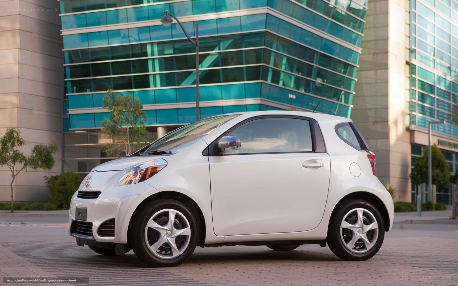 White compact car in city