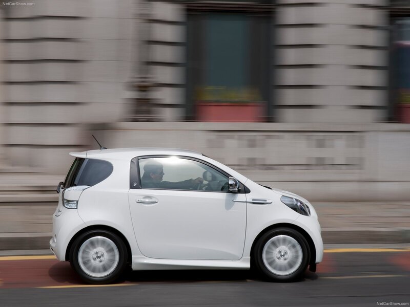 White compact car in motion