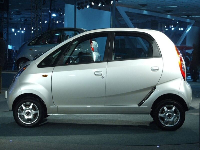 white compact car on display