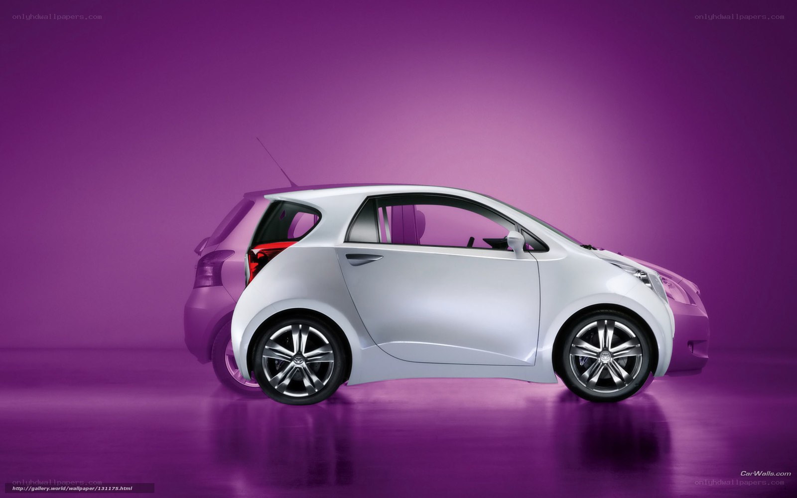 White compact car on purple background