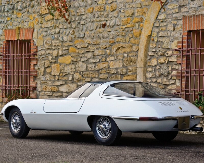 white concept car by stone wall