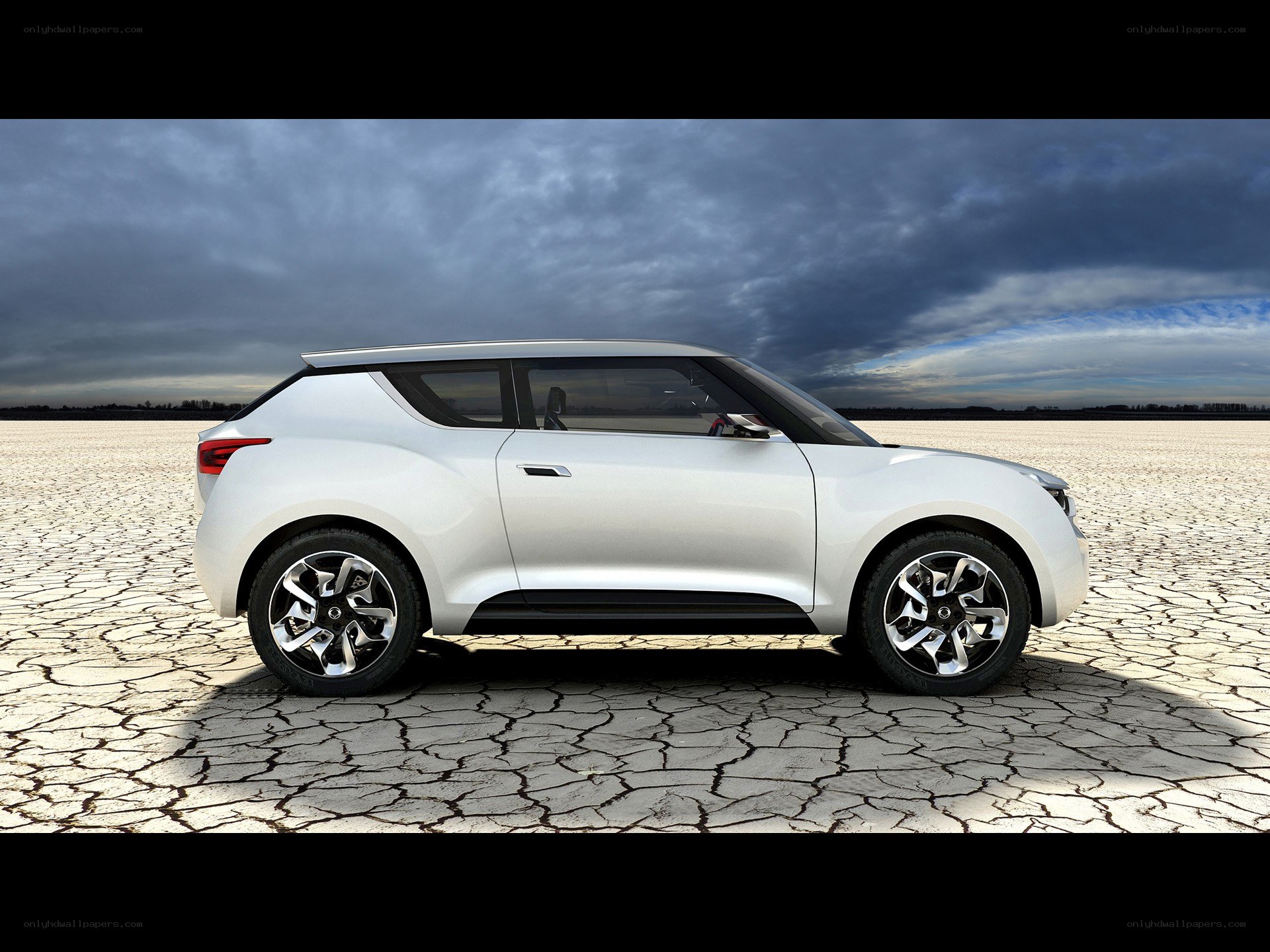 White concept car on cracked ground