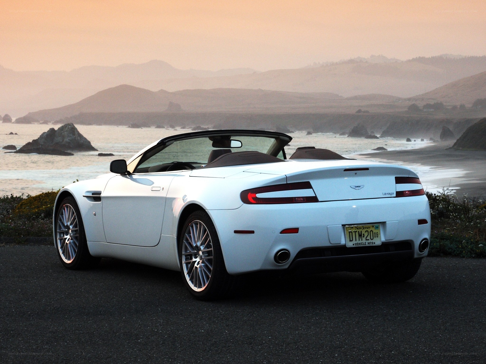 White convertible by the coast