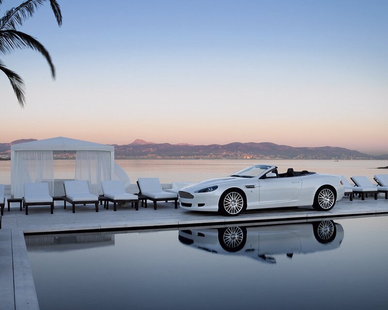 White convertible by the pool