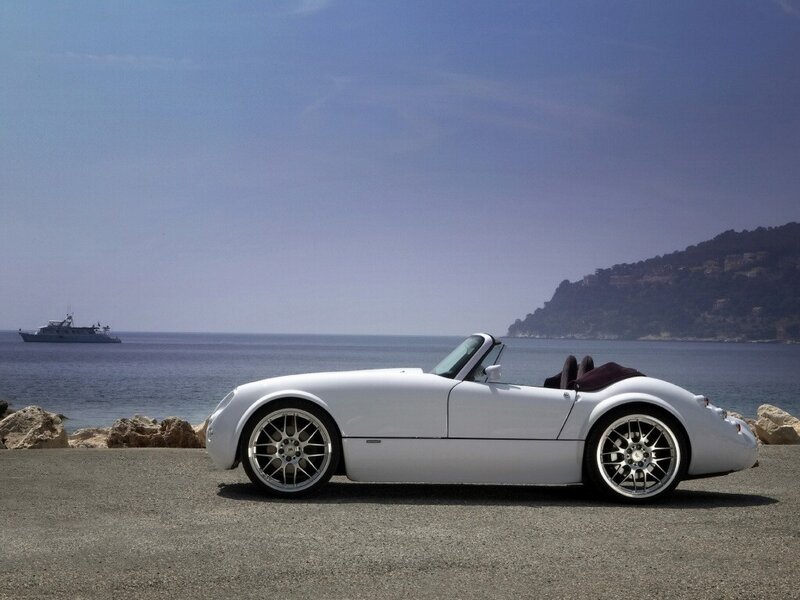 White convertible by the sea