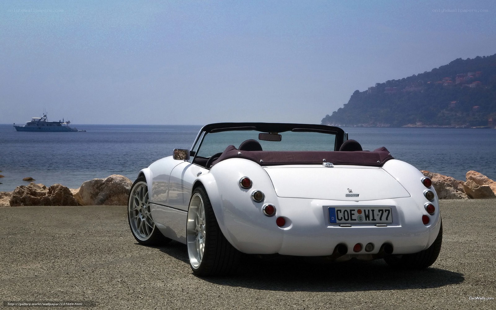 White convertible by the sea