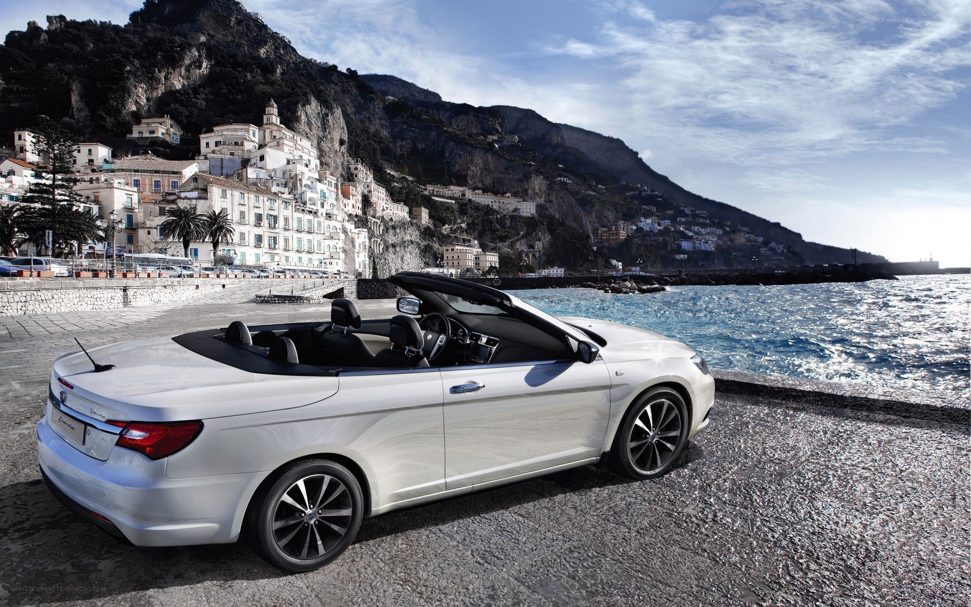 White convertible by the sea