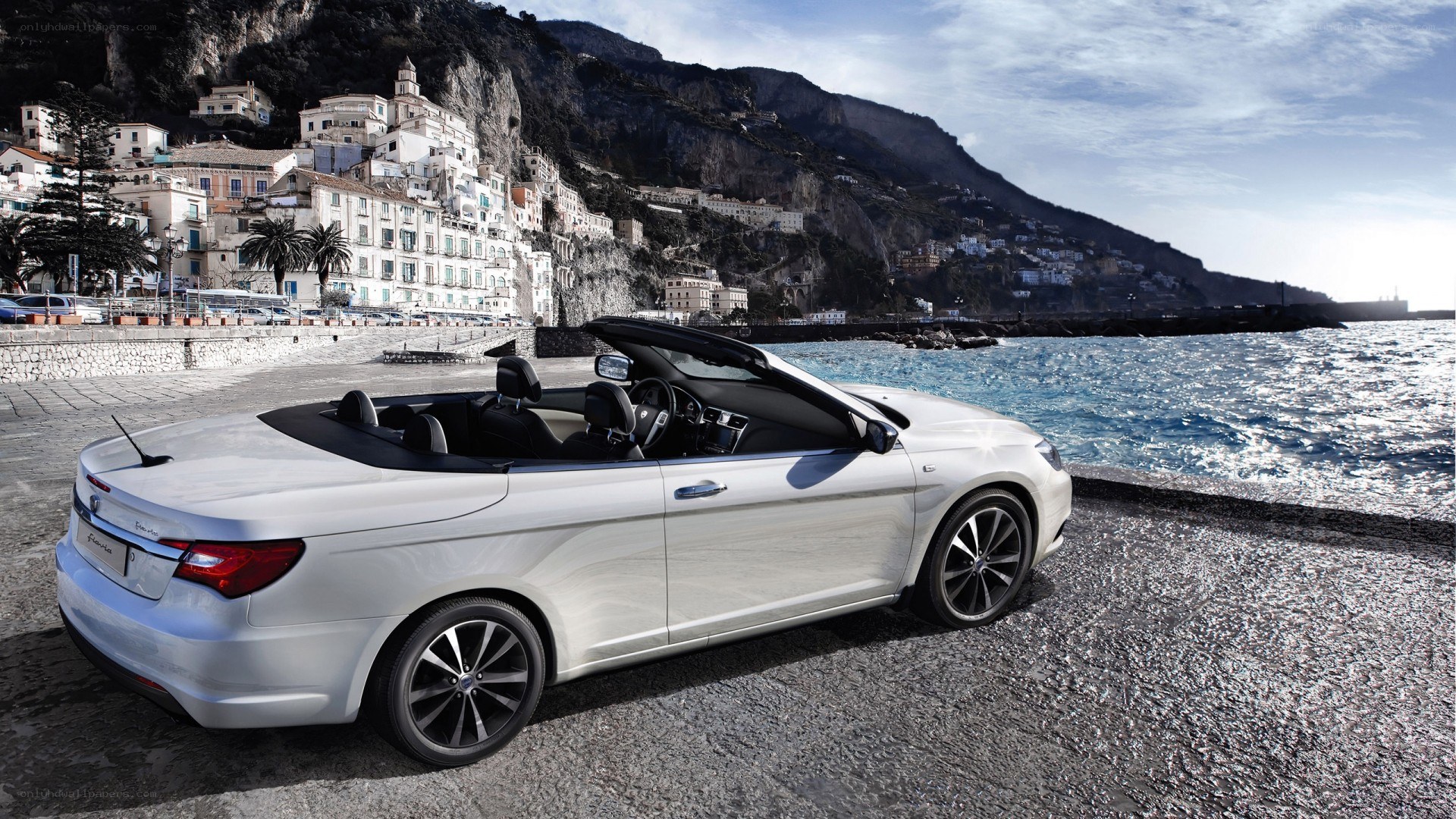 White convertible by the sea