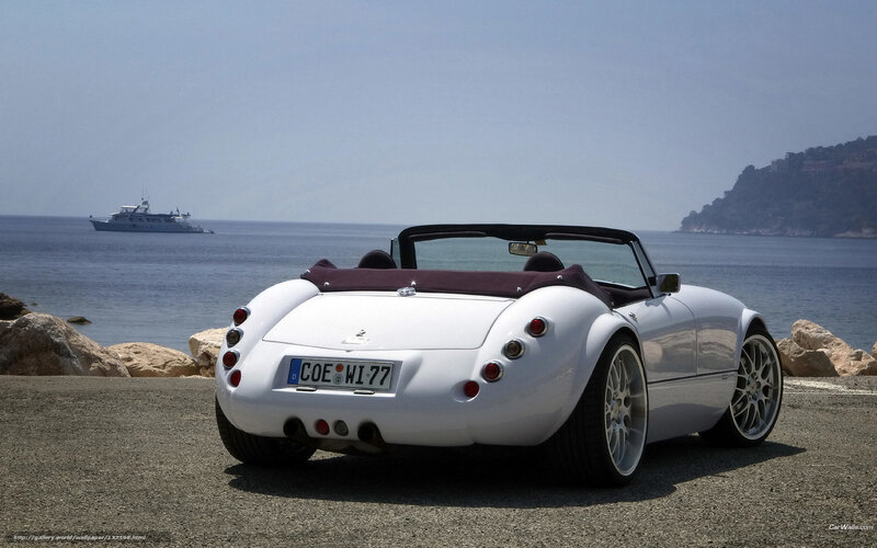 White convertible by the sea